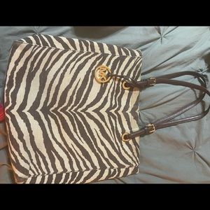 Michael Kors animal print shoulder bag.